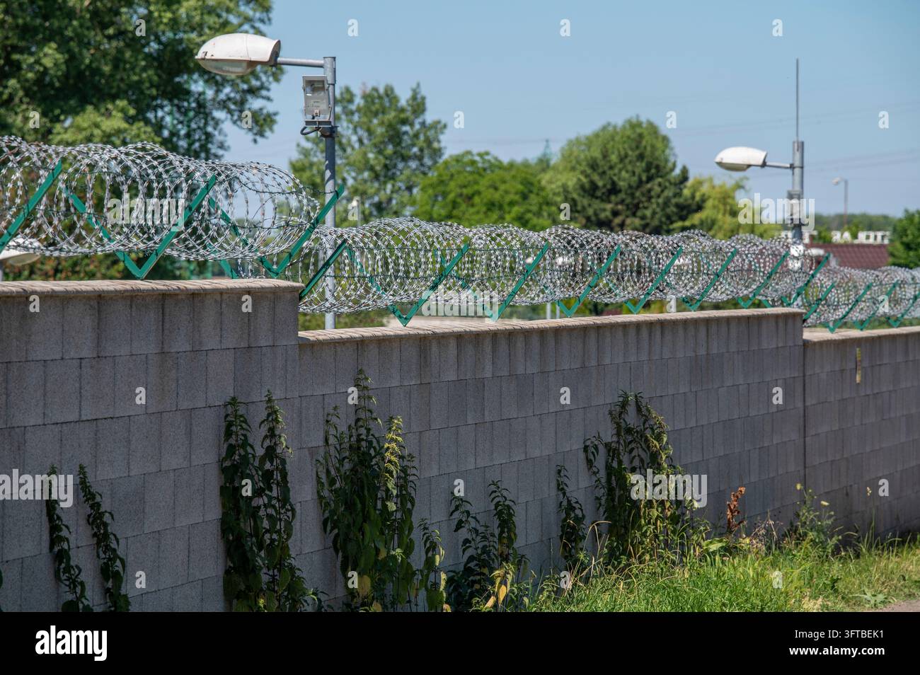 Barbed Wire Security Fence on a Concrete Wall in Slovakia Stock Photo ...