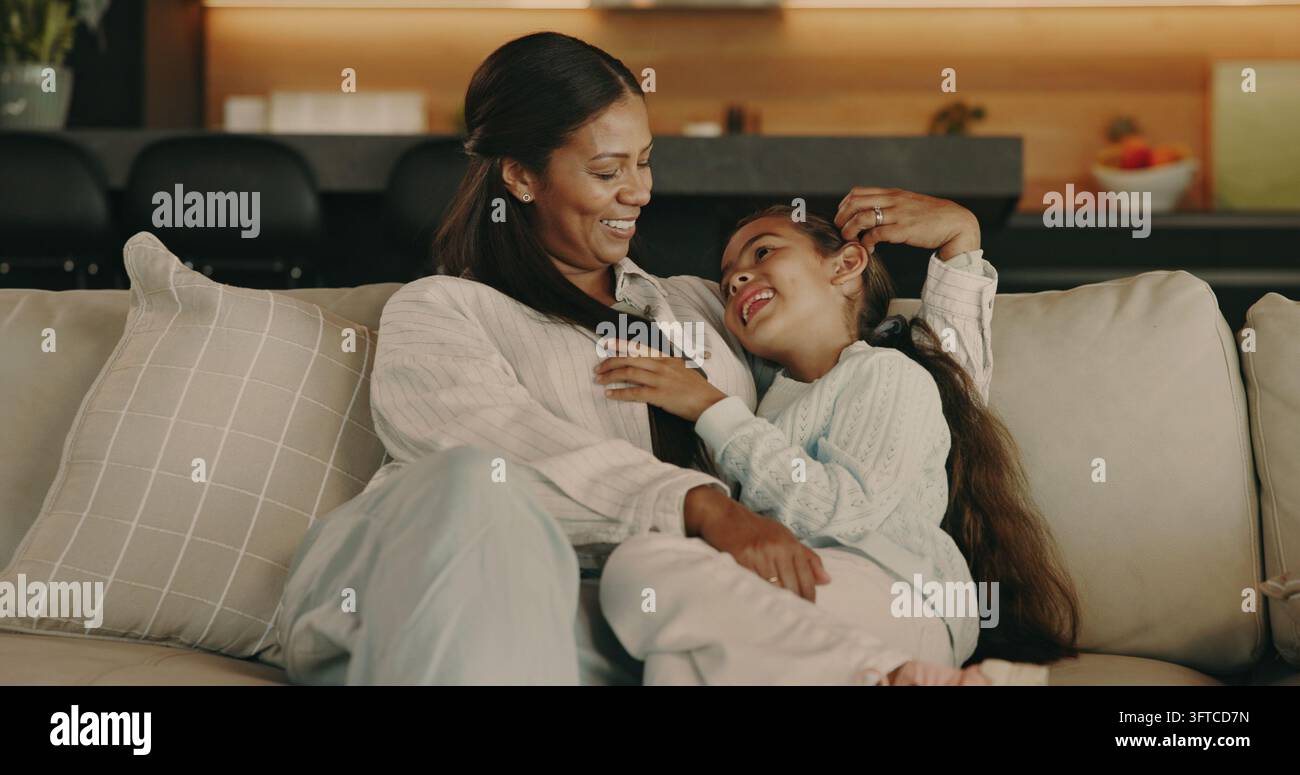 Weekend Connecting Cuddle, laugh and mom with girl on sofa for bonding, playful ...