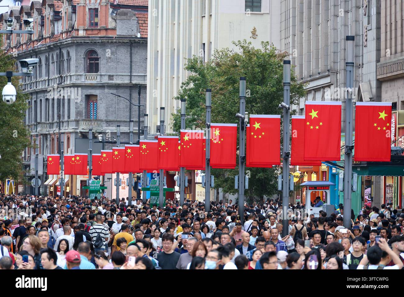 Tourists crowd the observation deck at the Bund in Shanghai on October ...