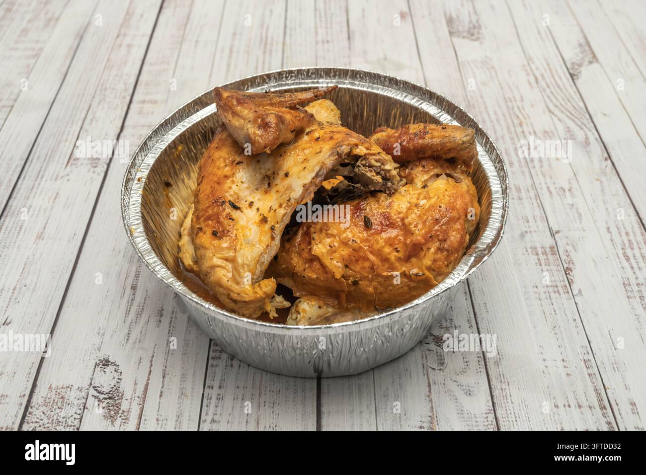 Herb-seasoned roasted chicken pieces with juicy orange-glazed skin and ...