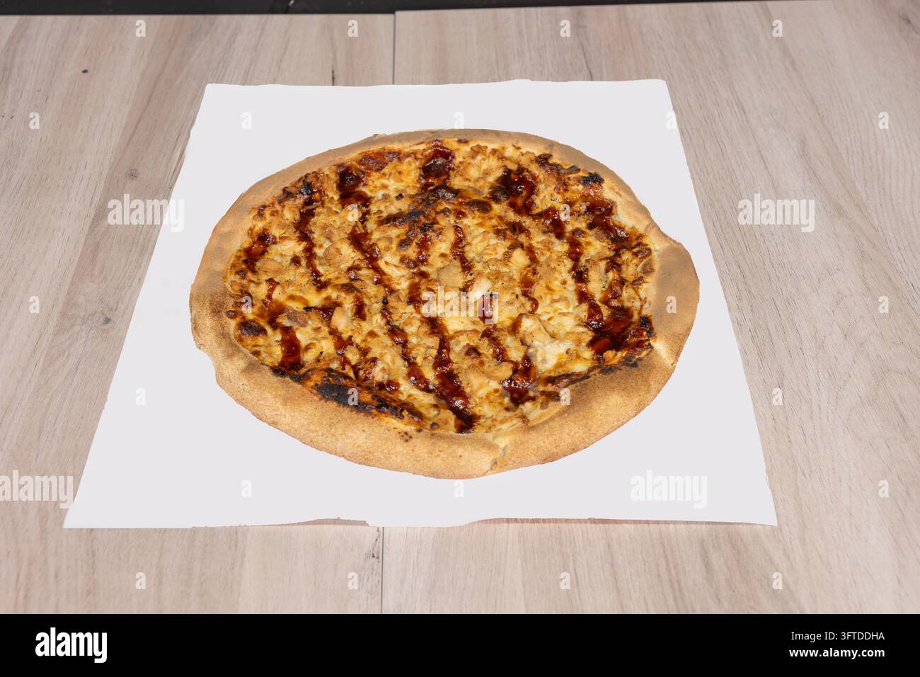Barbecue chicken pizza topped with shredded chicken, bubbling melted ...