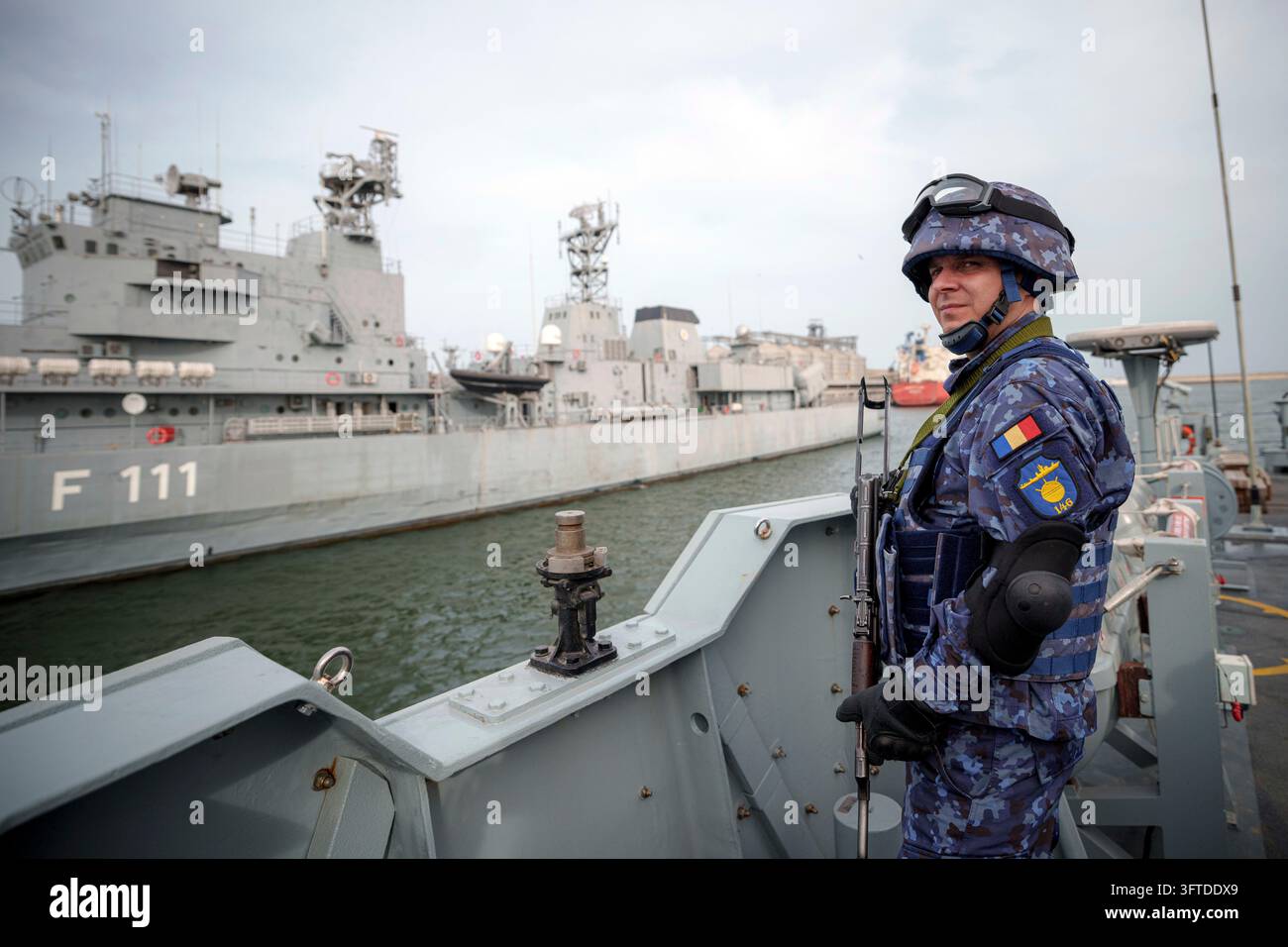 FILE - A Romanian naval serviceman guards onboard the M-270 Mine-hunter ...