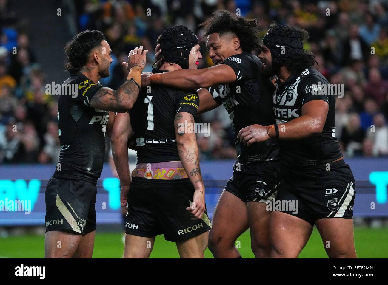 New Zealand's Kalyn Ponga (1) celebrates with teammates after scoring a ...