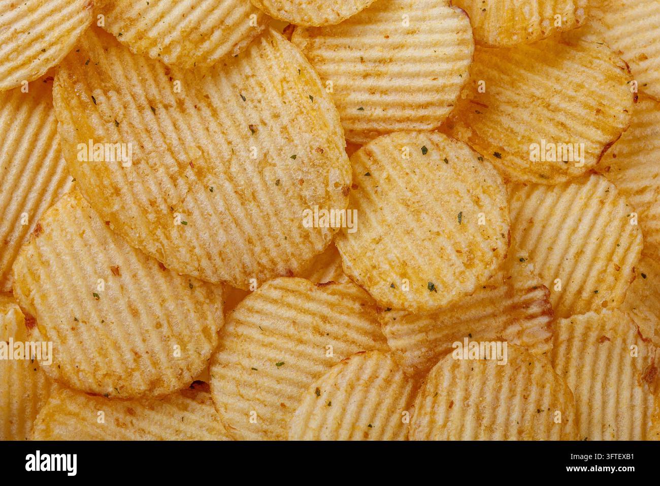 Lots of potato chips, texture close up Stock Photo
