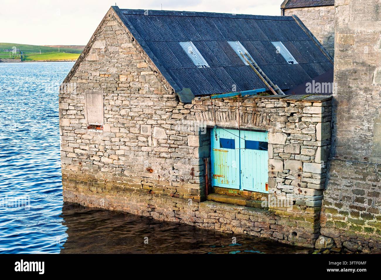 Traditional stone boathouse beside the sea in Lerwick, Shetland Stock ...