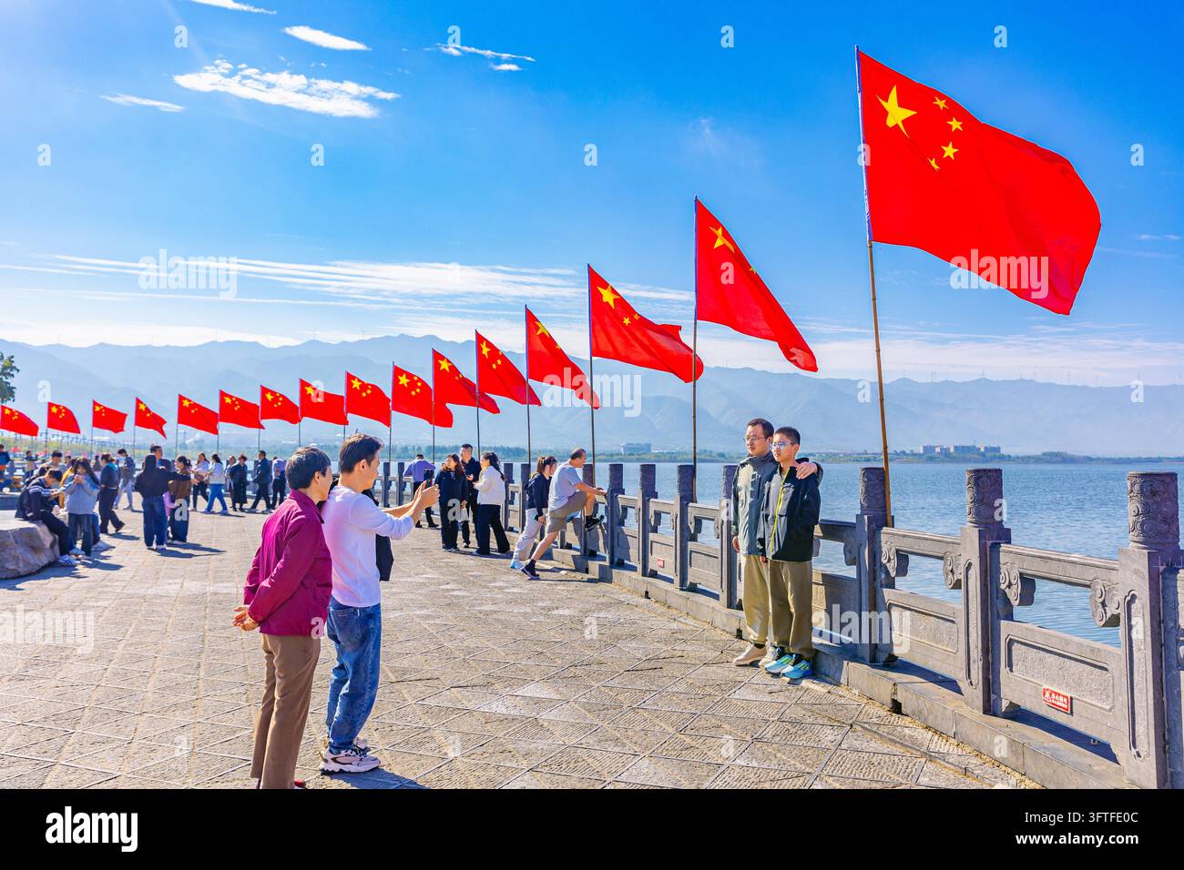 National flags flutter along the cross-lake avenue of Salt Lake in ...