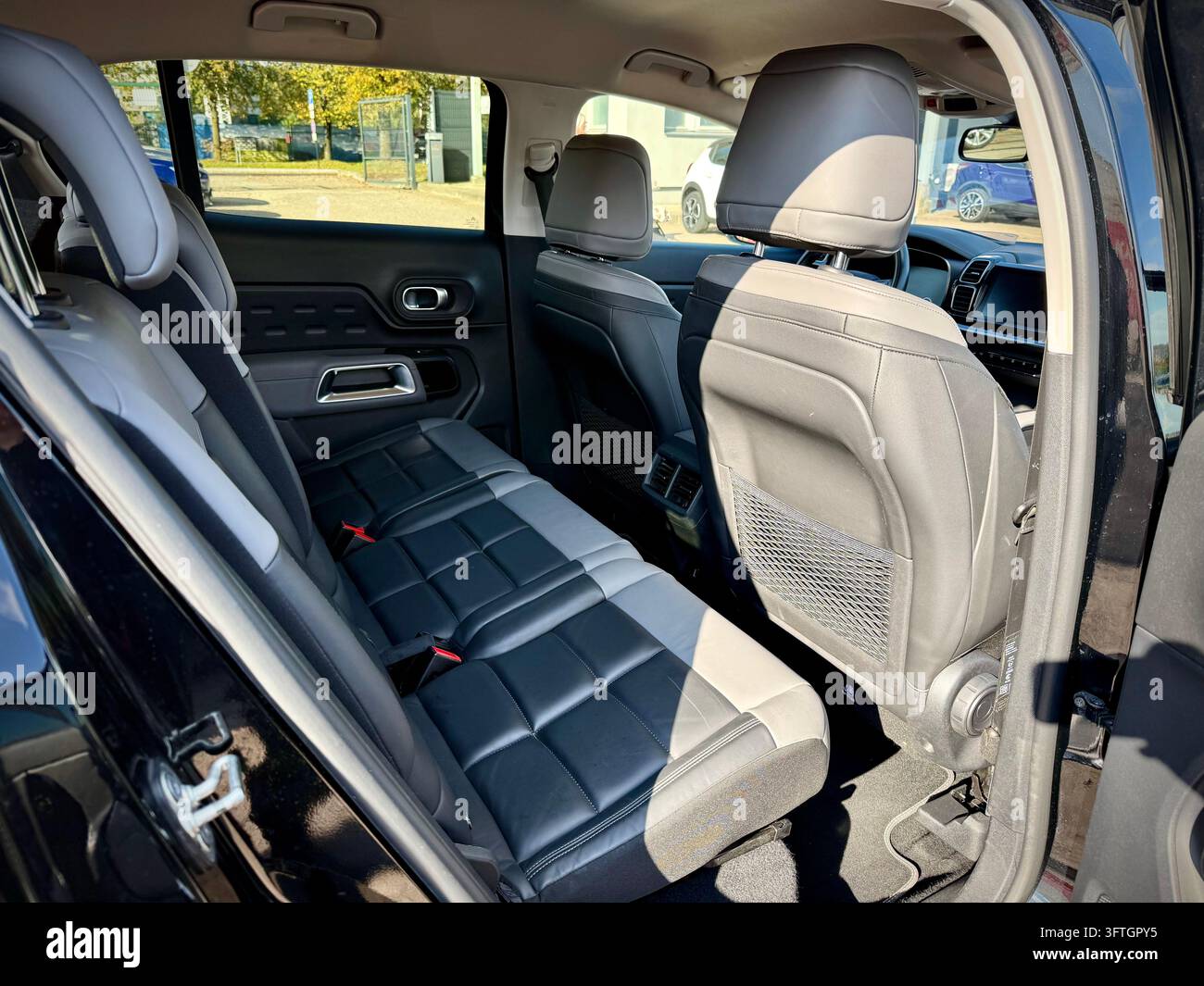 Citroën C5 Aircross with black and grey leather upholstery, comfortable headrests, and clean carpet flooring. - Smartphone Captured Stock Image