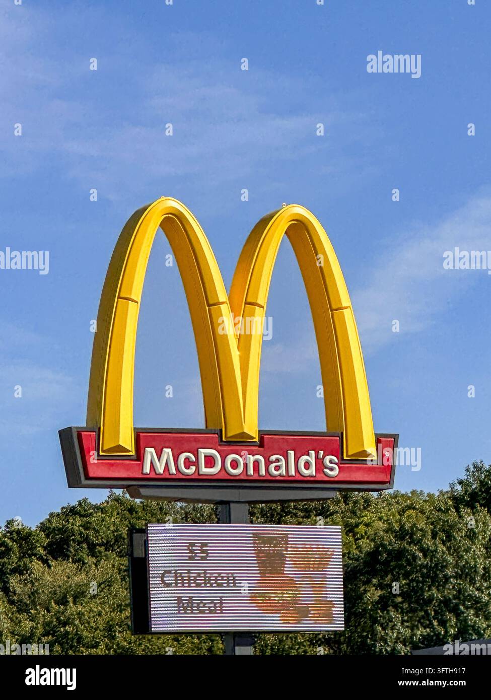 Iconic McDonald's golden arches sign against a clear blue sky. Portage, IN USA October 6, 2025 - Smartphone Captured Stock Image