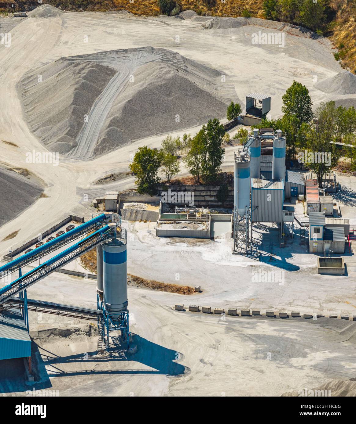 Aggrated Aerial view of an industrial sand and gravel processing quarry ...