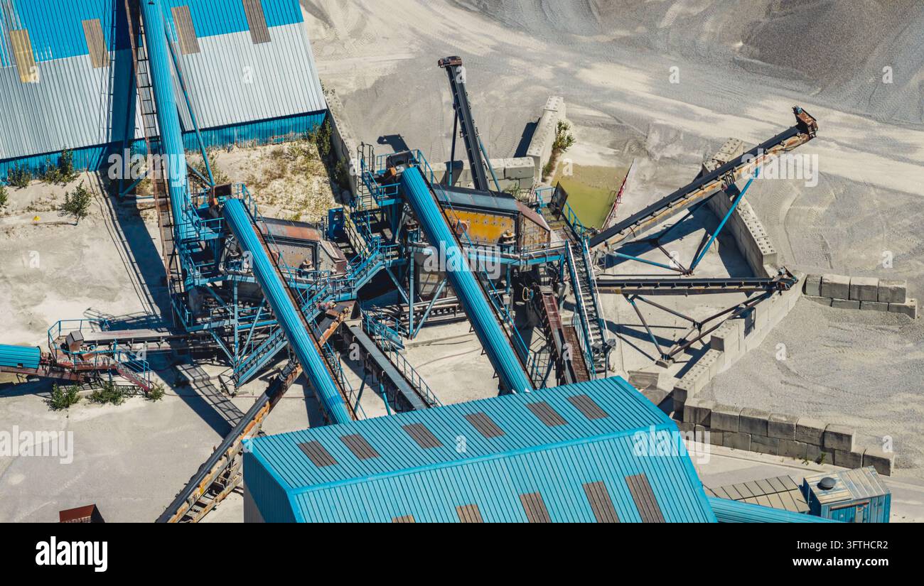 Aggrated Aerial view of an industrial aggregate screening installation with blue ...