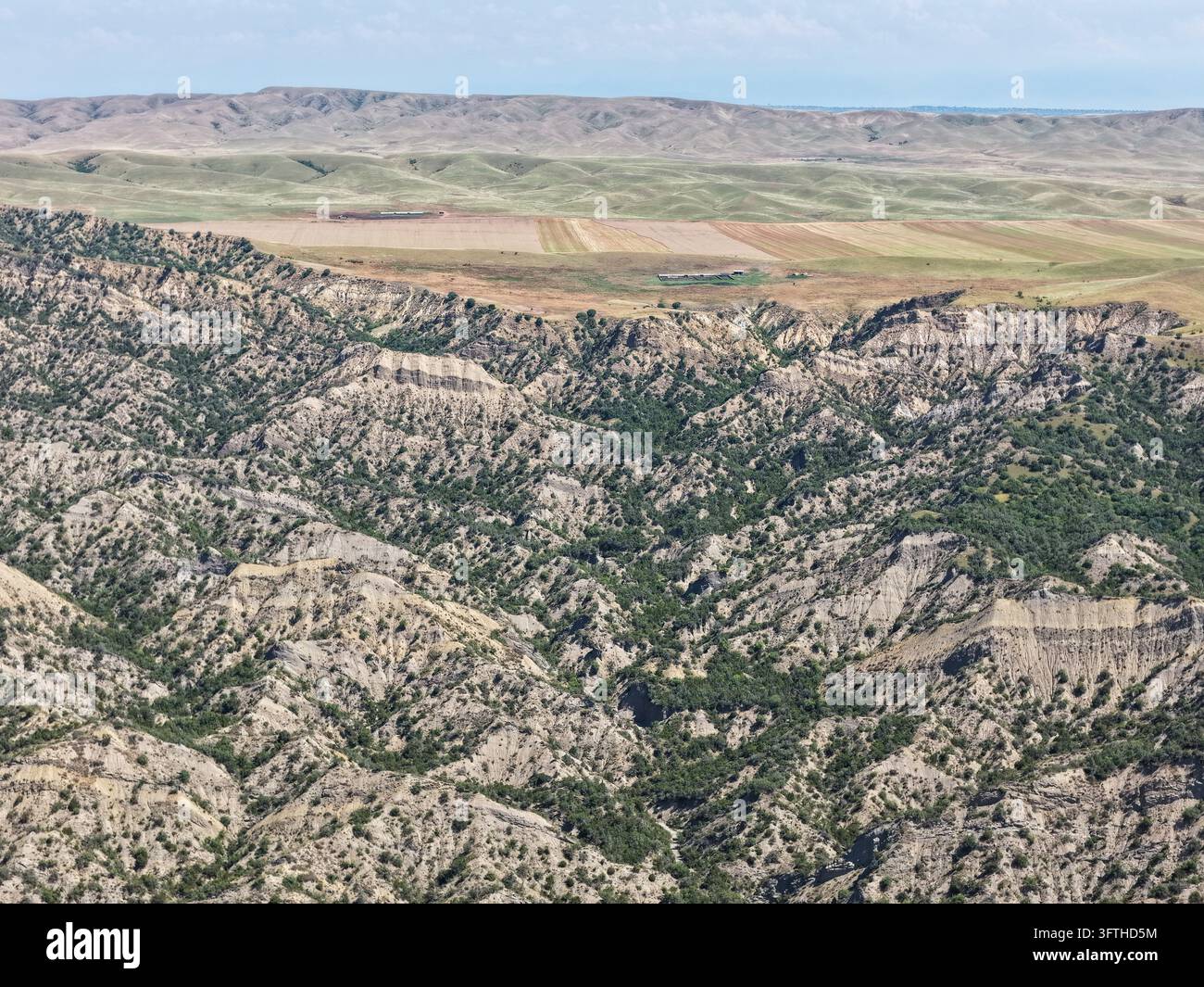 Aerial view of Vashlovani National Park featuring rugged arid hills ...