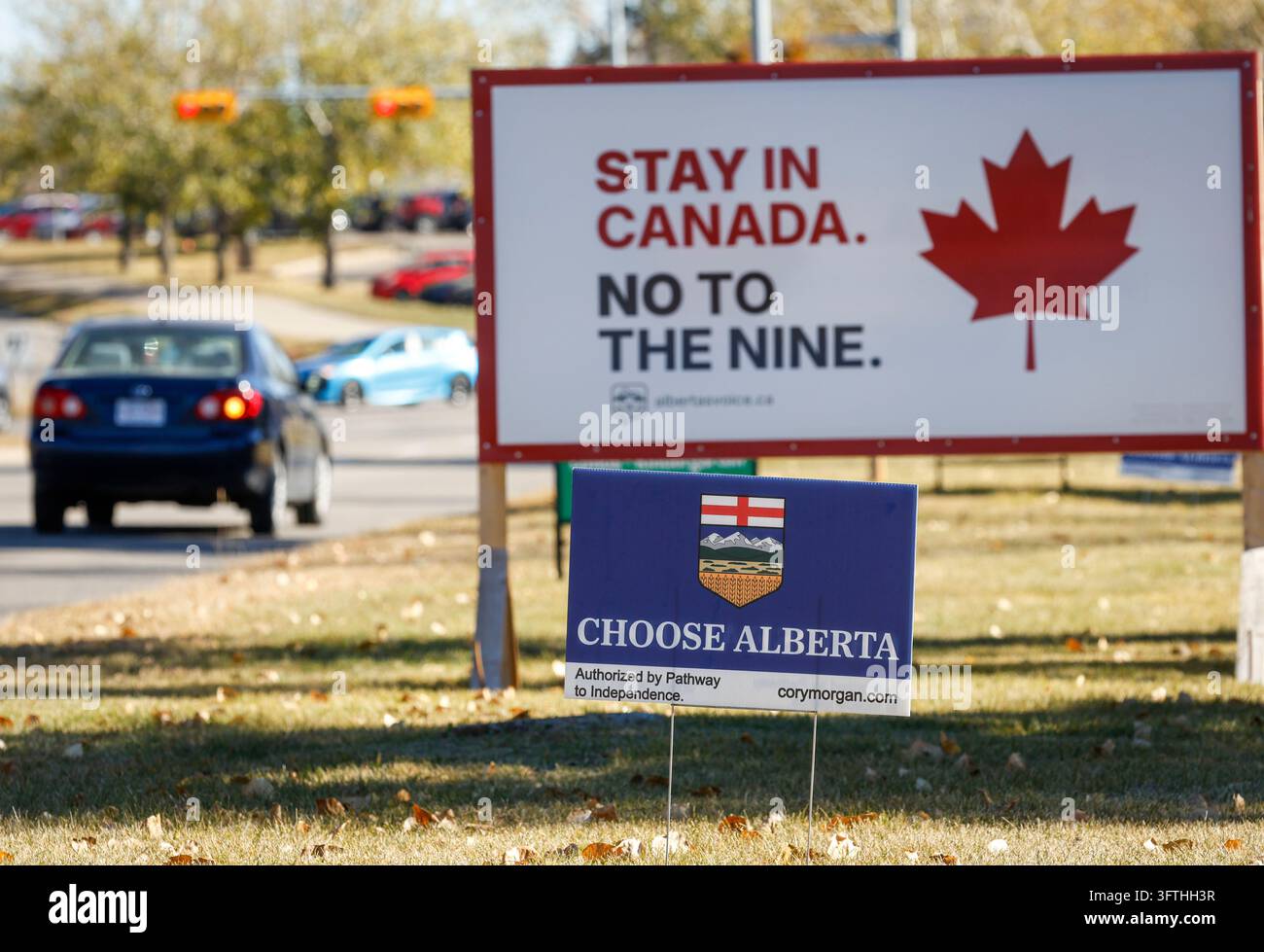 Competing referendum signs line a boulevard in Calgary, Canada ...