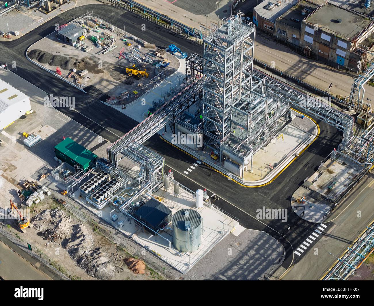 Model Tank Shelf Aerial view of a chemical processing facility featuring a tall steel ...