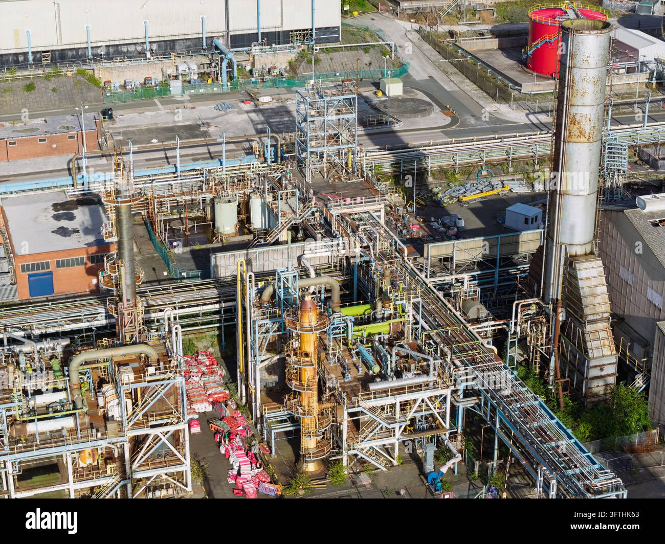 Model Tank Shelf Aerial view of a chemical plant featuring complex industrial piping ...