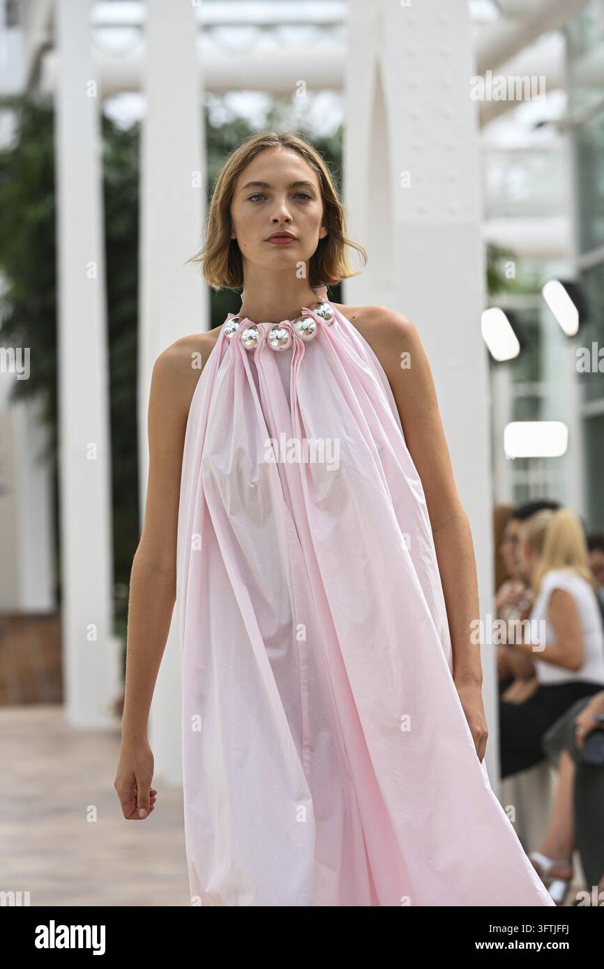 Sevigna Model A model parades with Simorra design during Mercedes Benz Fashion Week ...