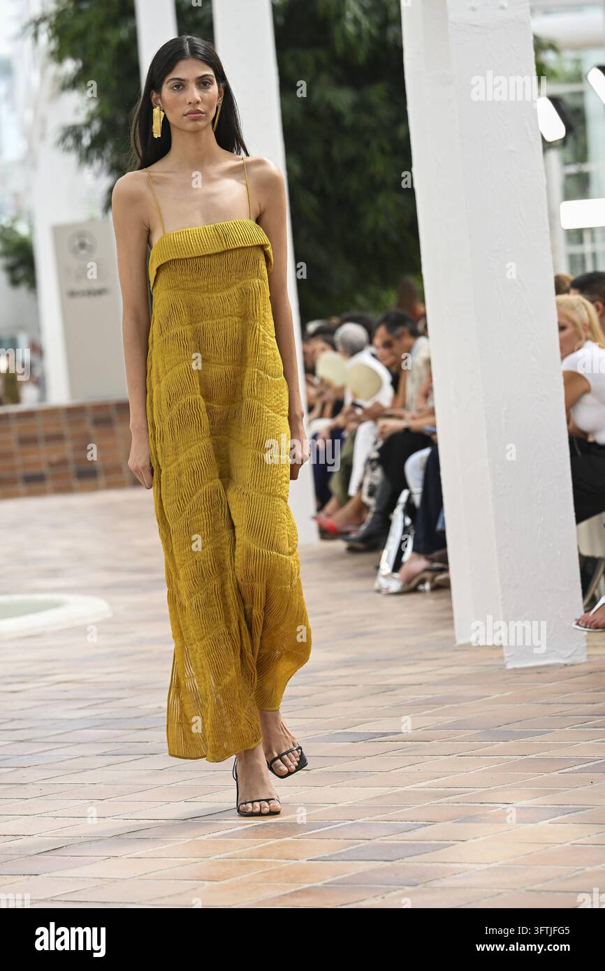 Sevigna Model A model parades with Simorra design during Mercedes Benz Fashion Week ...