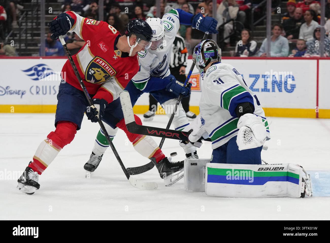 Second Left Sign Vancouver Canucks goaltender Leevi Meriläinen (31) defends the goal ...