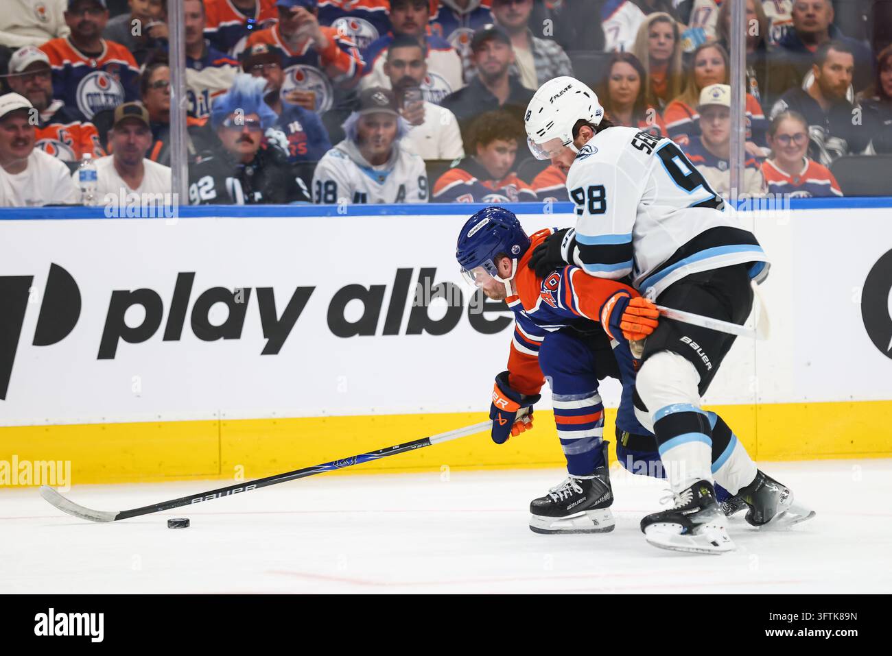 Second Left Sign Edmonton Oilers' Max Jones, left, battles against Utah Mammoth's ...