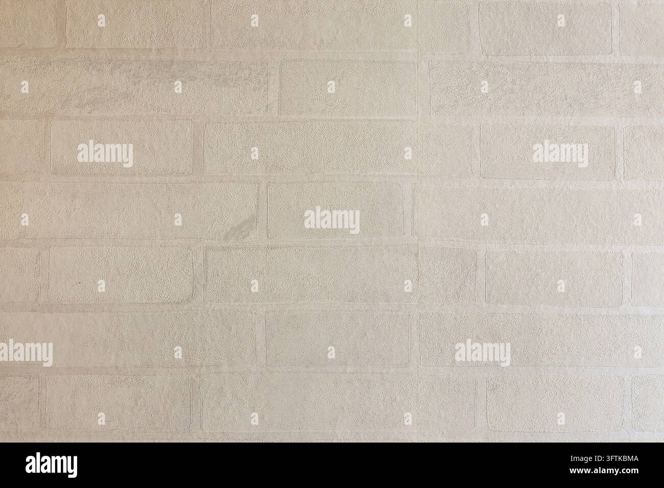 A light beige brick wall texture with subtle weathered surface and soft ...
