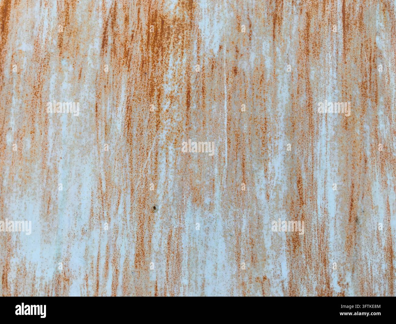 Close-up of a distressed pale blue painted metal surface with vertical ...