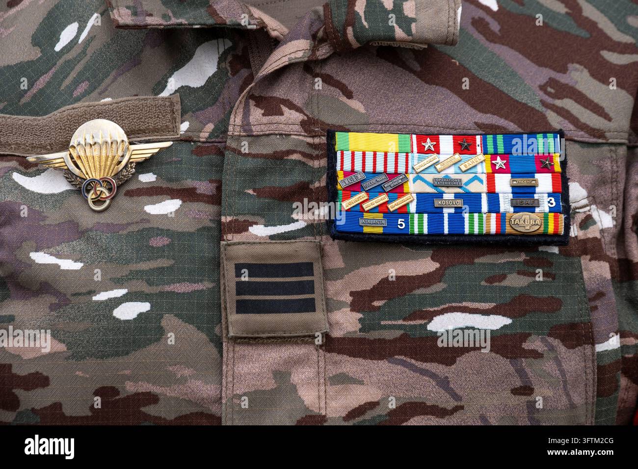 A French soldier wears his military decorations on his fatigues during ...