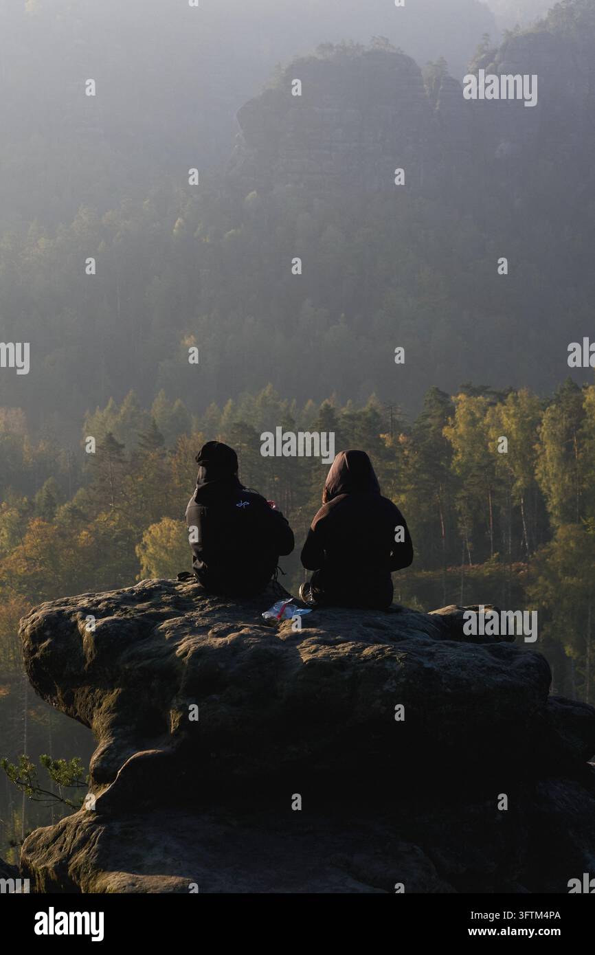 Bad Schandau, Germany. 16th Oct, 2026. A man and a woman are sitting on ...