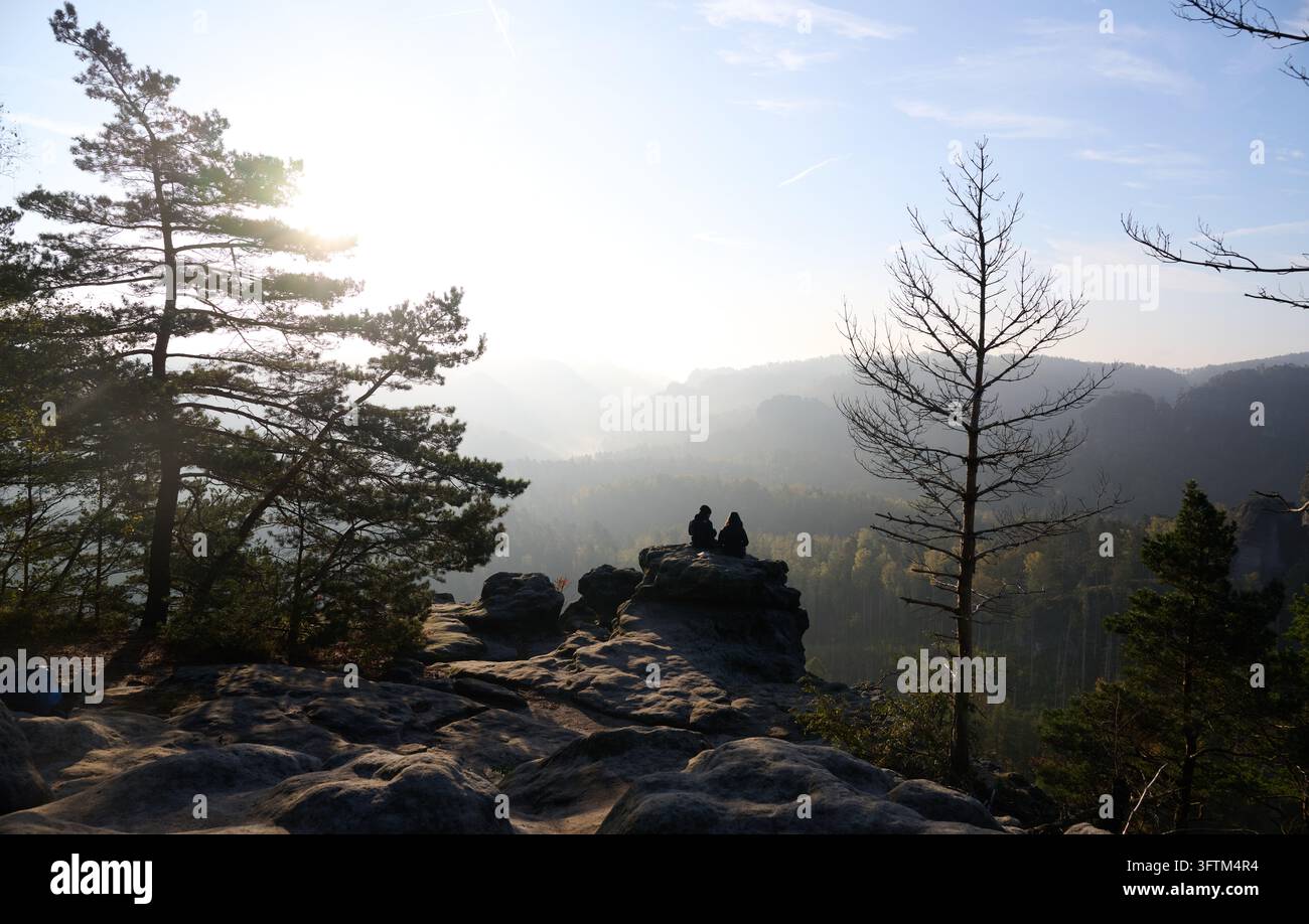 Bad Schandau, Germany. 16th Oct, 2026. A man and a woman are sitting on ...