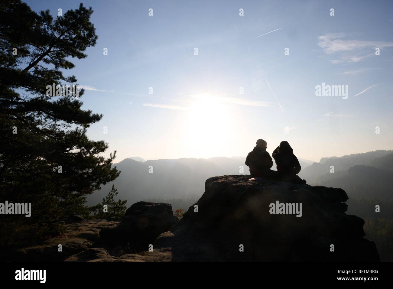 Bad Schandau, Germany. 16th Oct, 2026. A man and a woman are sitting on ...