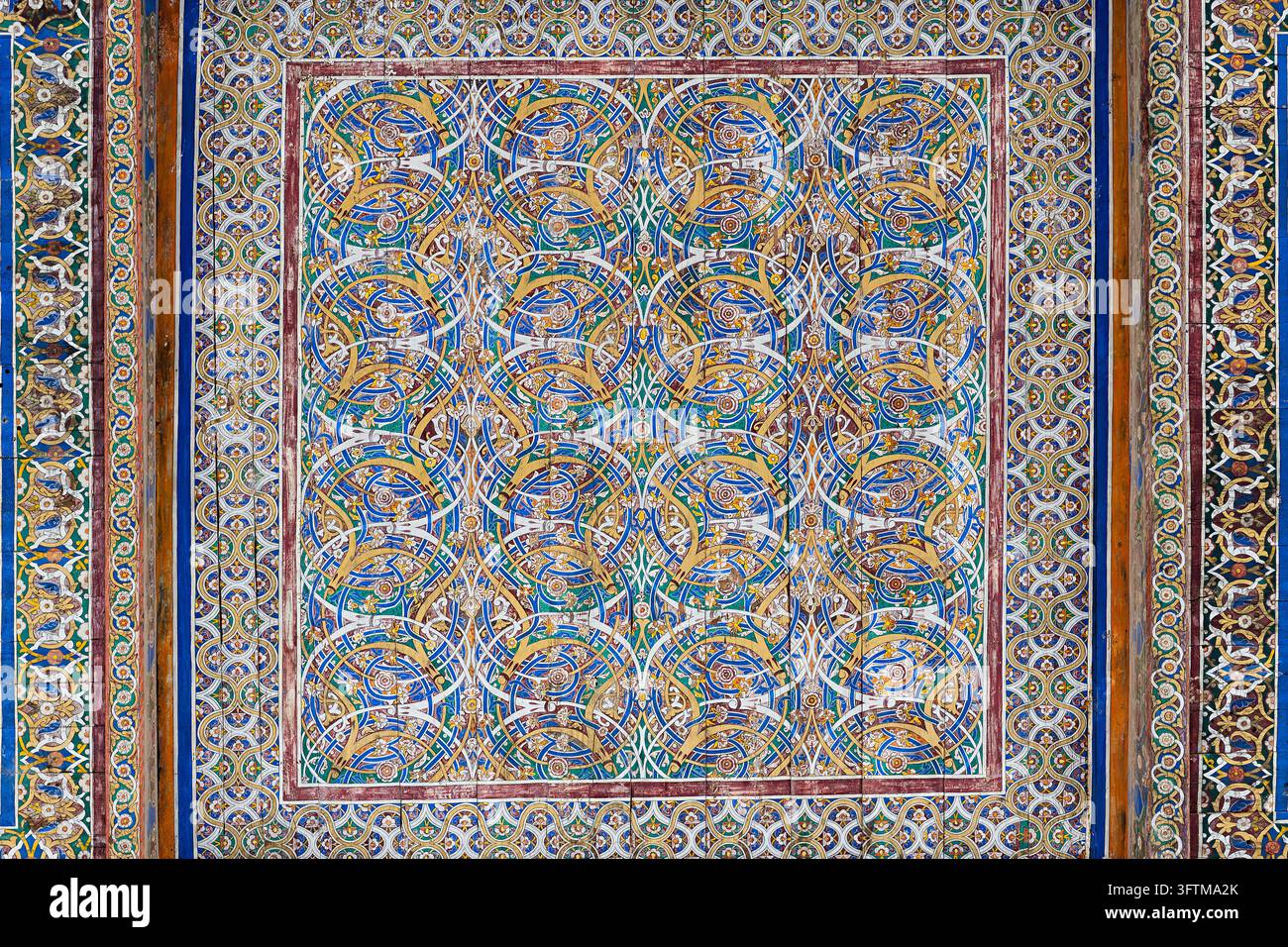 Ornate painted ceiling panel with intricate arabesque patterns at ...