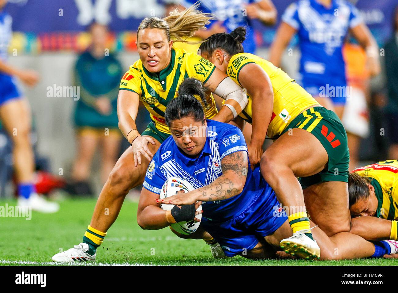 Annetta Nuuausala of Samoa is tackled during the Women's Rugby League ...