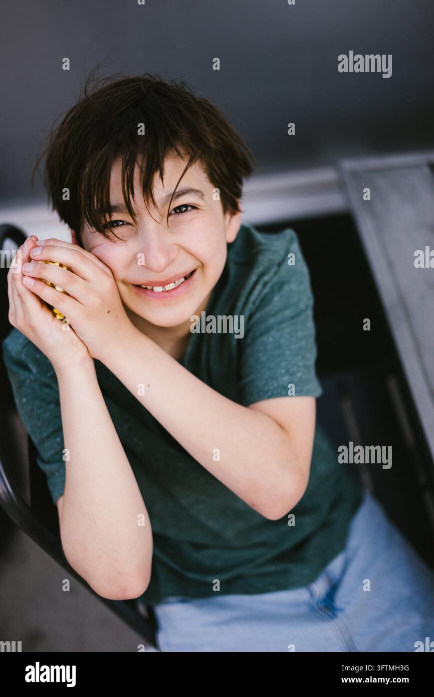 High angle view of a happy boy smiling at the camera Stock Photo