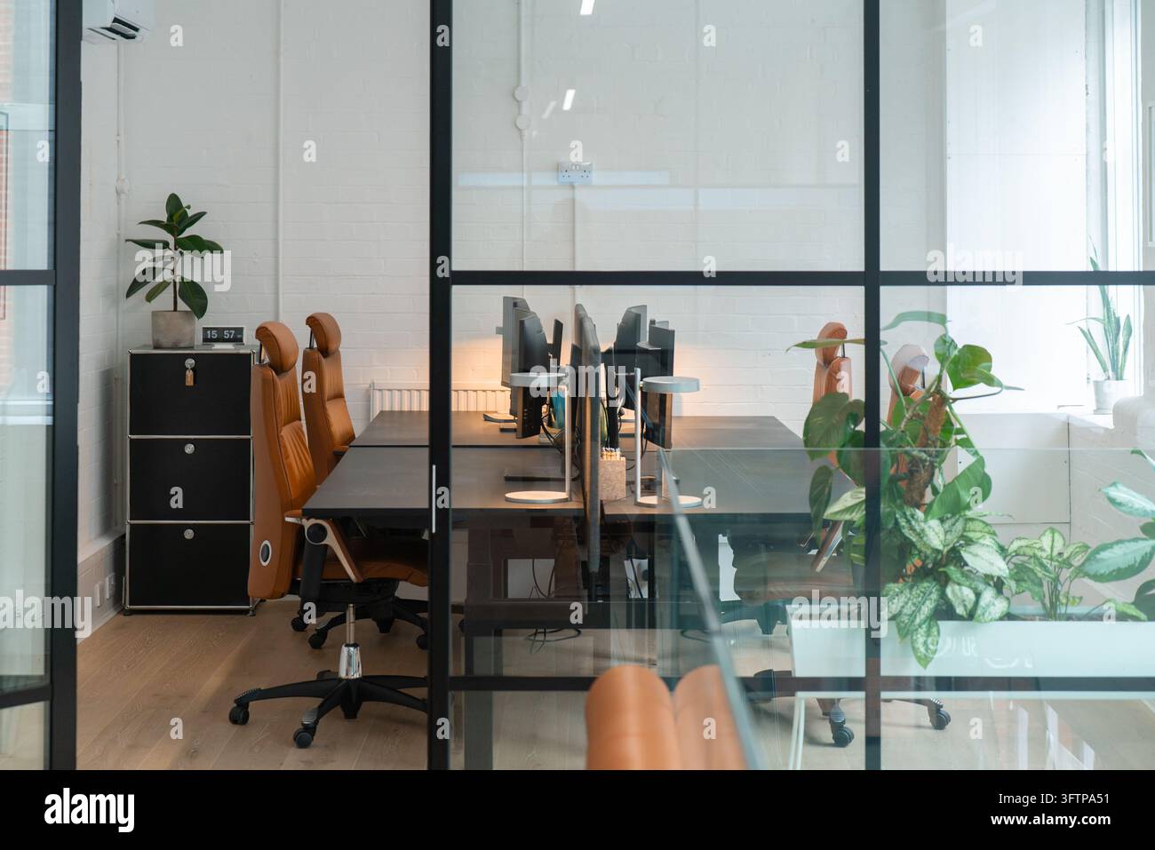 View of a modern office interior with ergonomic leather chairs, black ...