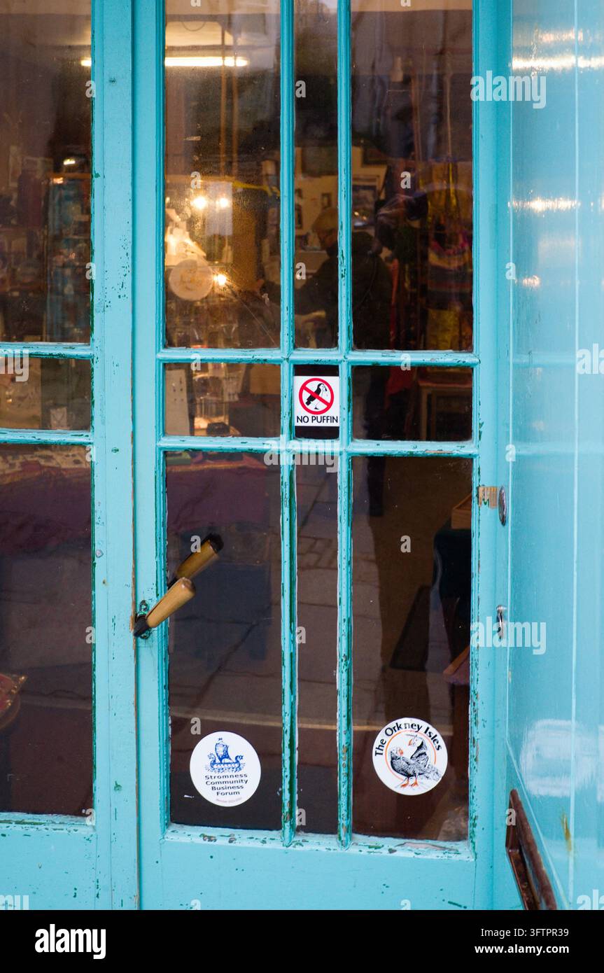 No puffin sign on door of a shop in Stromness, Orkney Stock Photo - Alamy