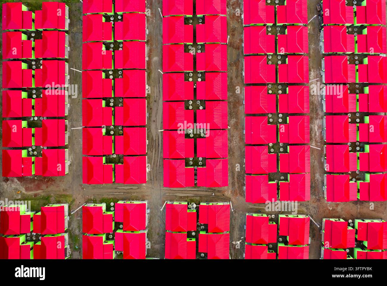 Aerial view of a residential housing development featuring rows of ...