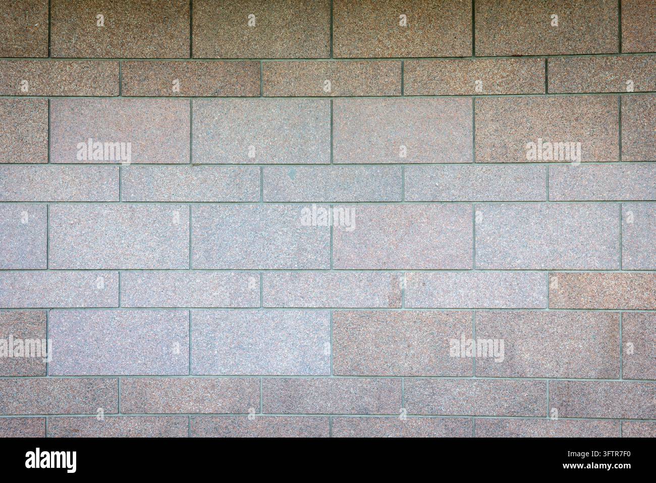 Modern Brown and Grey Granite Tiled Stone Wall Texture Background Stock Photo