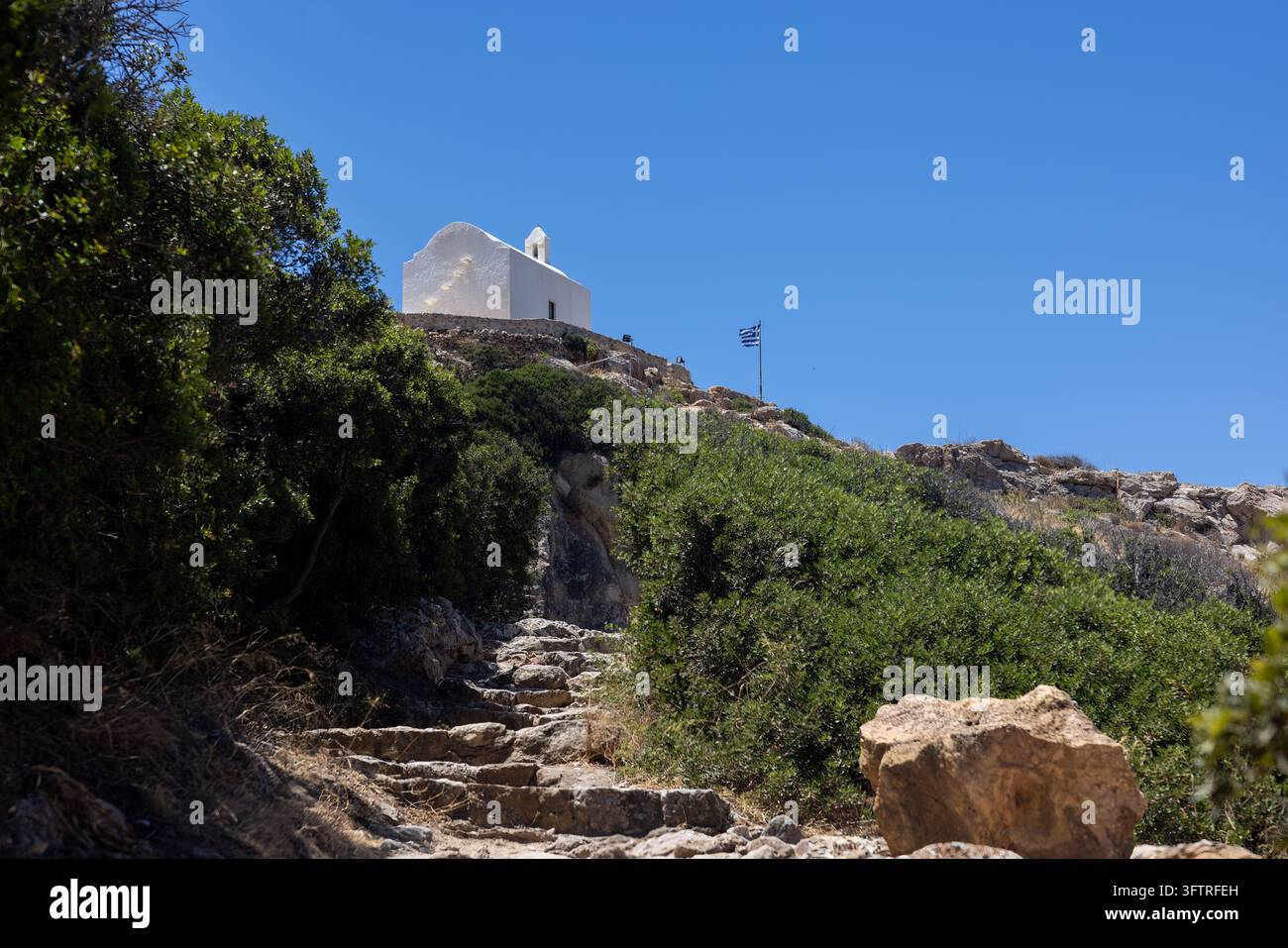 The small whitewashed Chapel of Agia Pakou overlooks the coastline of ...