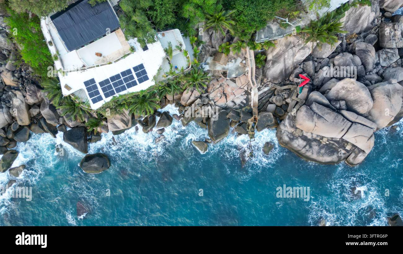 Aerial view of Ao Hin Wong Beach featuring a villa with solar panels ...