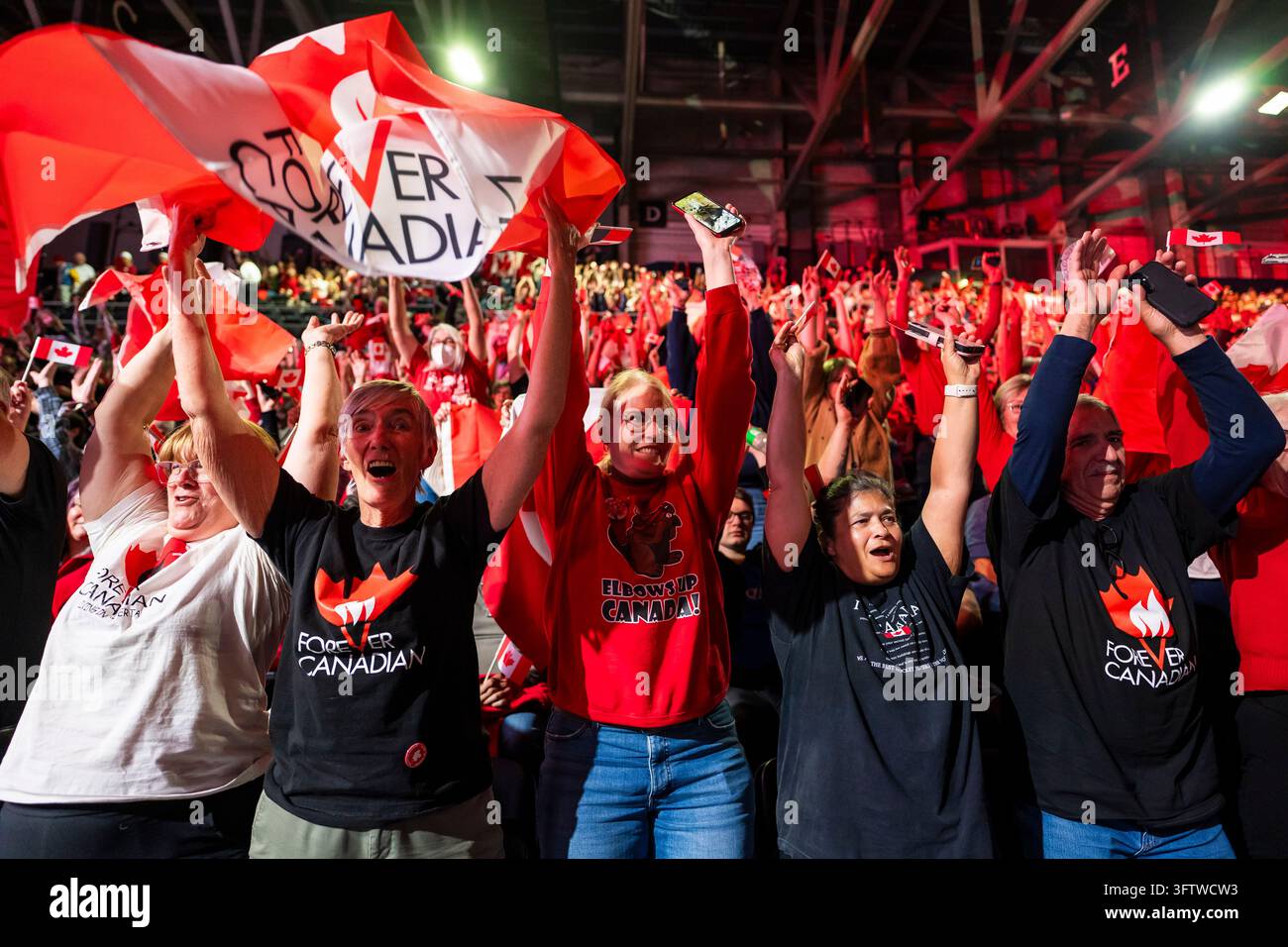 People cheer at a Forever Canadian rally in Edmonton, on Friday, Oct ...