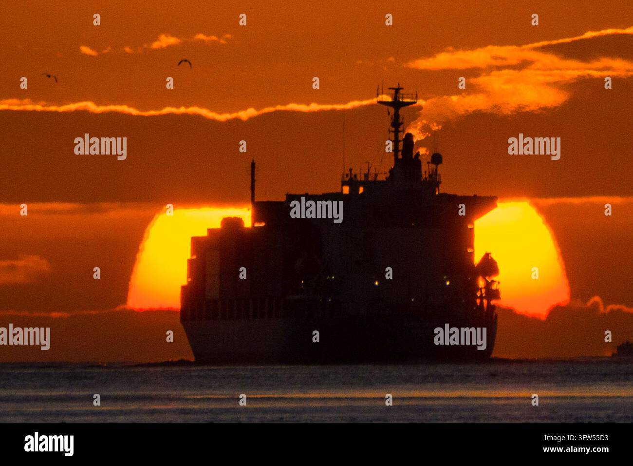 A container ship sailing during the sunset on October 18, 2026 in Hong ...