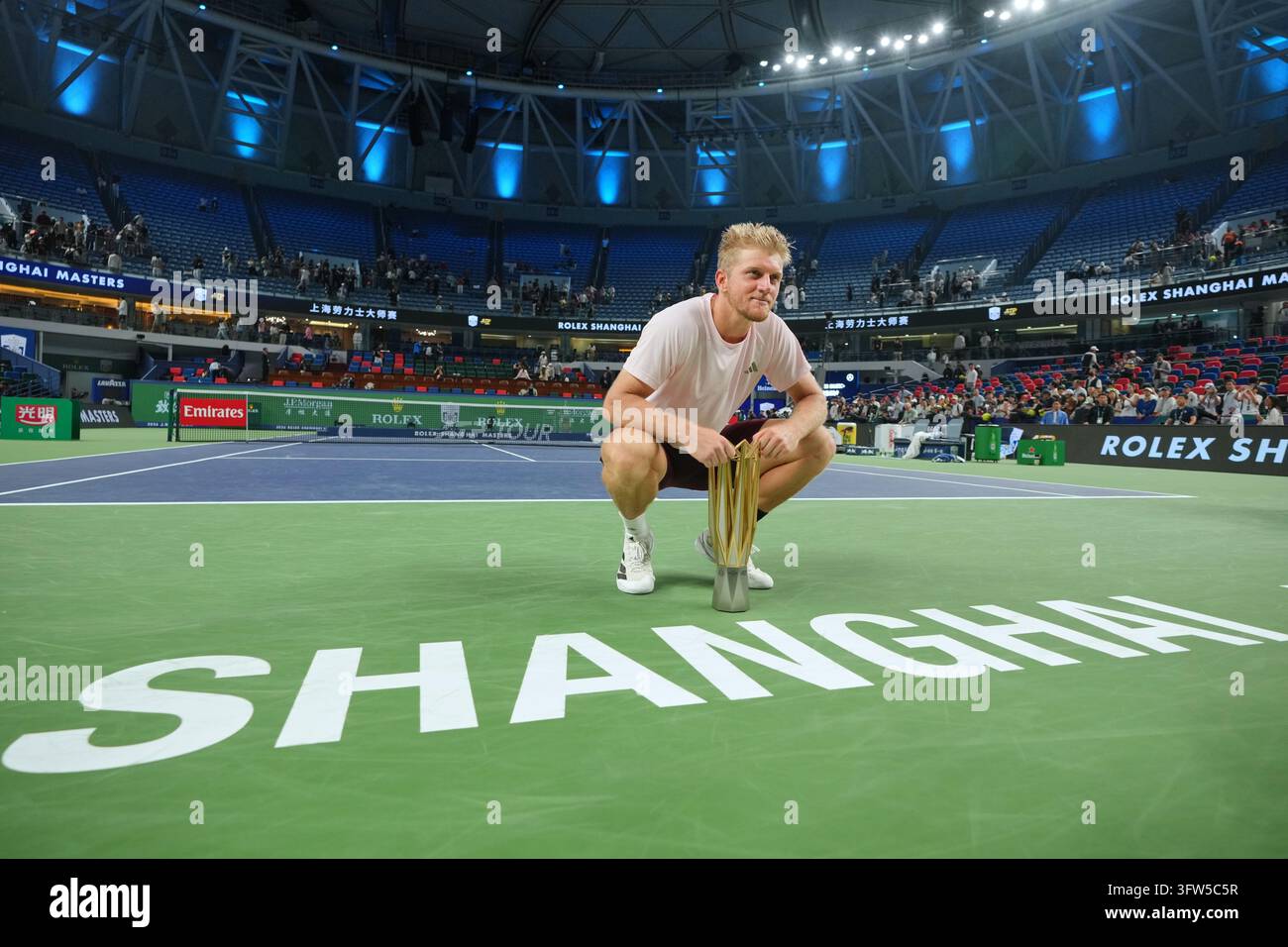 Spain's Alejandro Davidovich Fokina poses with the championship trophy ...