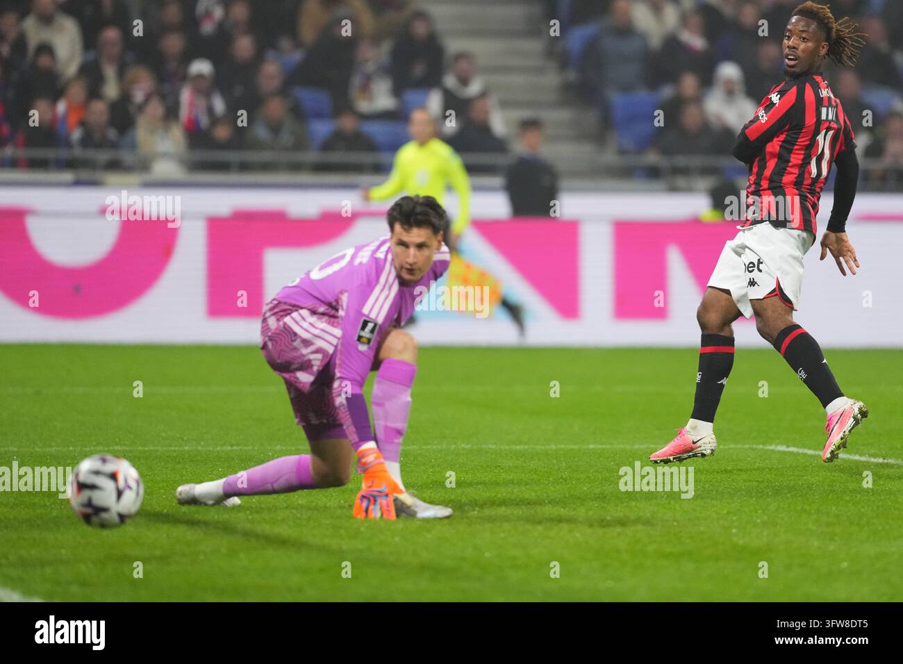 Remy DESCAMPS of Olympique Lyonnais and Elye WAHI of OGC Nice scores ...