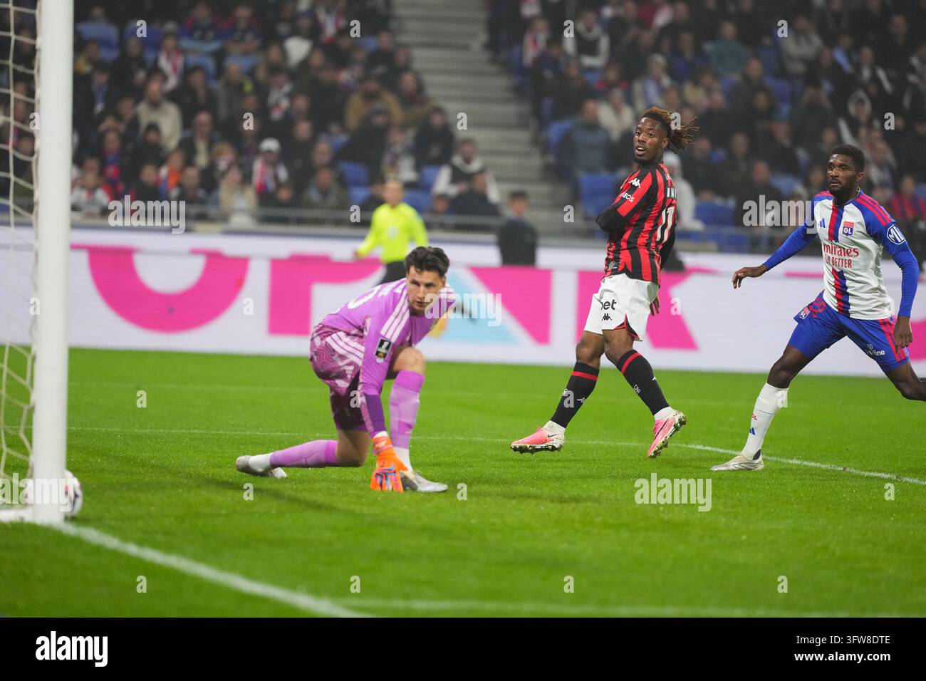 Remy DESCAMPS of Olympique Lyonnais and Elye WAHI of OGC Nice scores ...