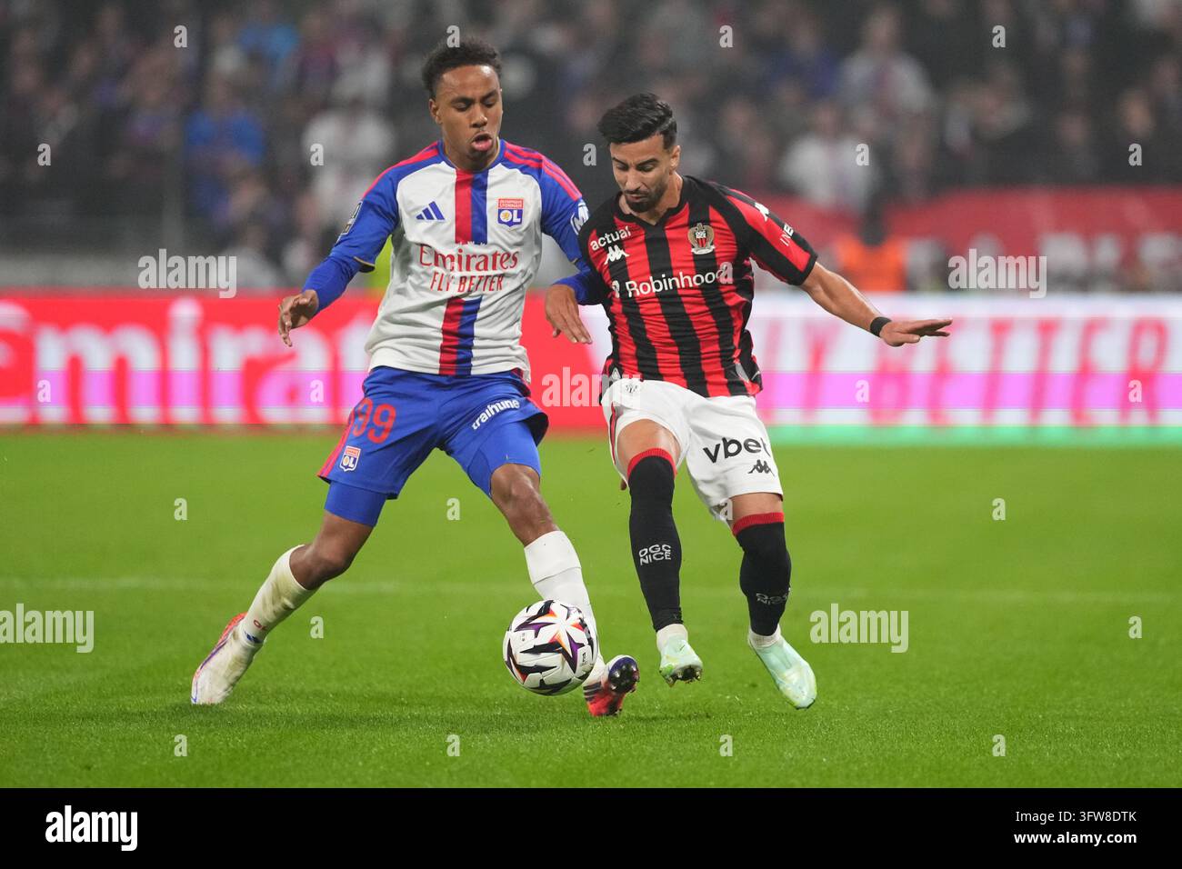Mohamed EL AMINE AMOURA of Nice and Noah NARTEY of Olympique Lyonnais ...