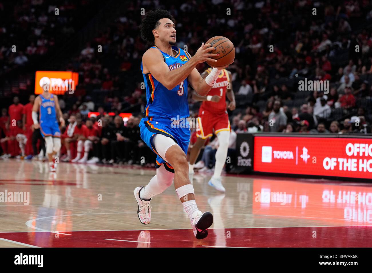 Thgunder Vector Oklahoma City Thunder guard Jared McCain scores on a fast break during ...