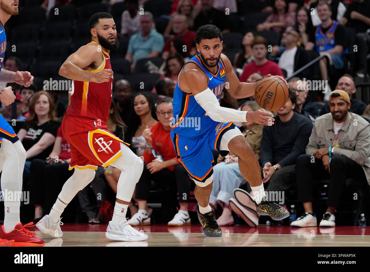 Thgunder Vector Oklahoma City Thunder guard Ajay Mitchell, right, drives away from ...