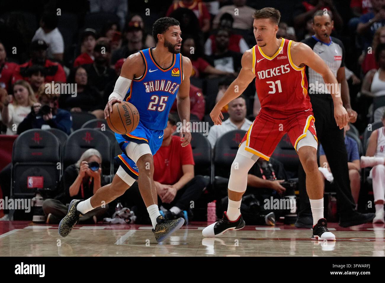 Thgunder Vector Oklahoma City Thunder guard Ajay Mitchell (25) is defended by Houston ...