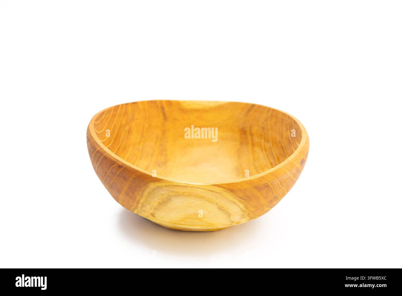 Small Empty Wooden Bowl in Three Quarter View on White Background Stock Photo