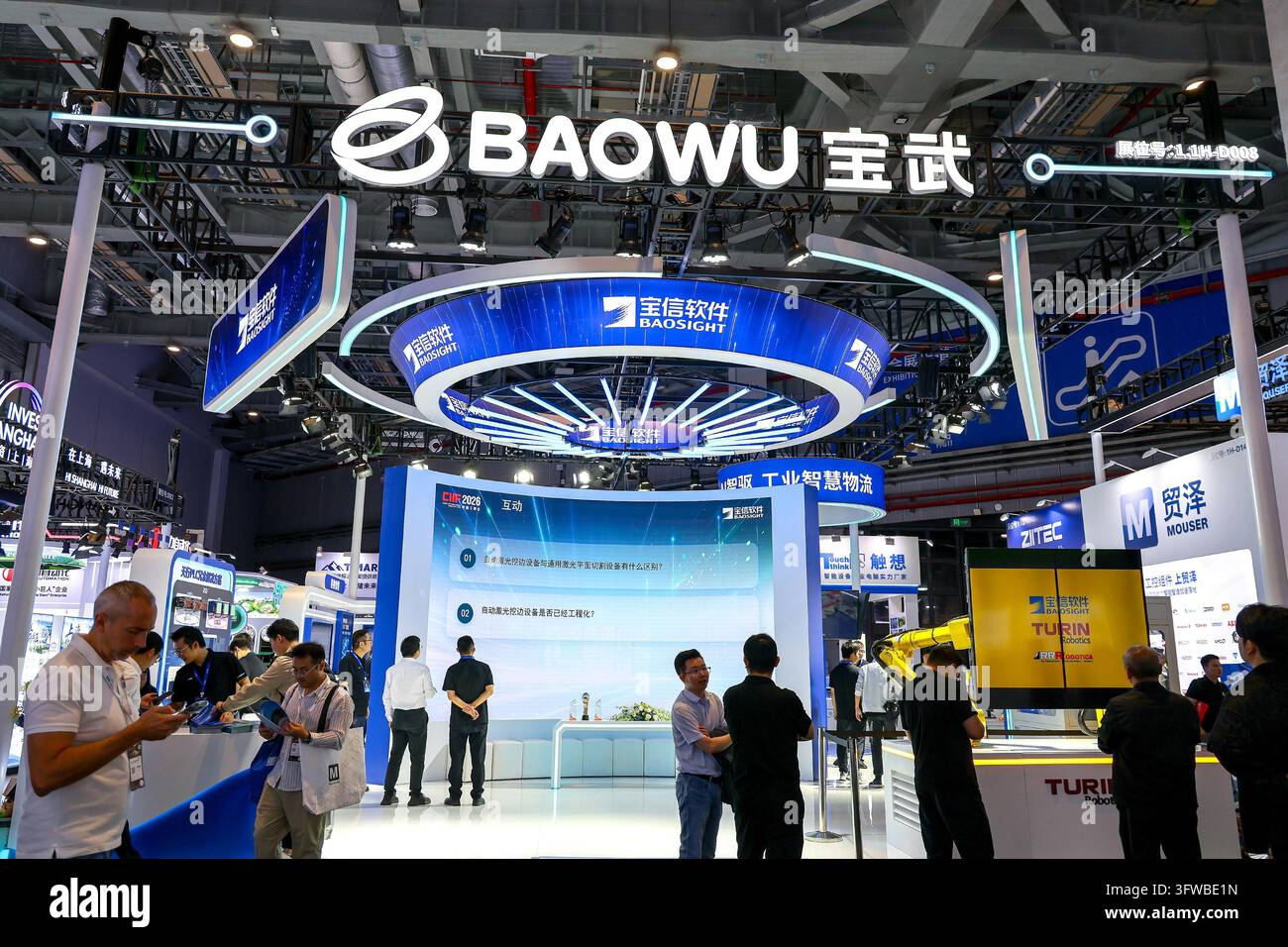 Visitors view the Baosight Software booth at China Baowu's exhibition ...