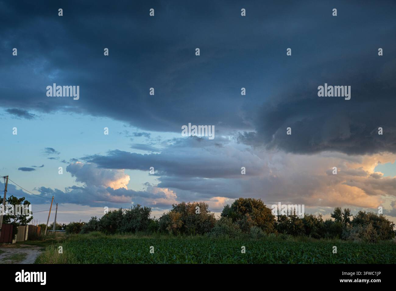 Cload Image Dark Storm Clouds Above a Rural Field in Warm Evening Light Stock Photo ...