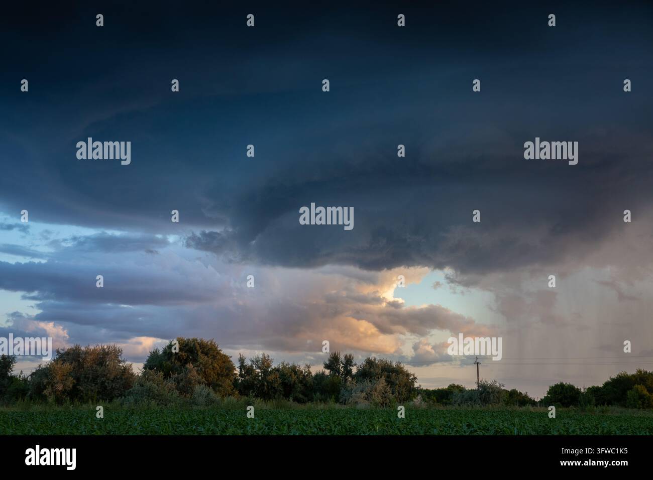 Cload Image Dark Storm Clouds Above a Rural Field in Warm Evening Light Stock Photo ...
